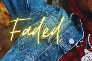 Cover of Faded by Lisa B. Trinidad. Photo of a Black man in a hoodie and denim jacket with his arm over his head. Title and author text.