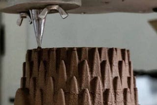 3D Printing in Clay: Using A Synchronized Auger Extruder With a Mechanical Supply Feed