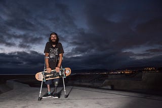 Conner Millan grabs his skateboard.