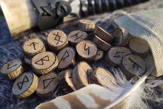 Picture of wooden pieces, each with a rune written on it