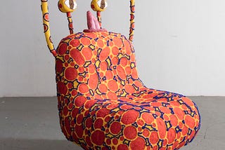 A sculpture formed in a shape of a chair.