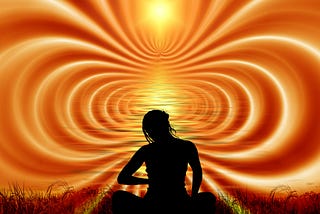 yellow and red waves of energy flow out from woman’s silhouette