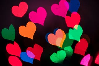 colorful hearts on a black background