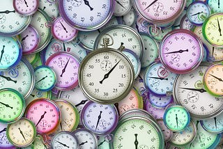 A bunch of clocks lying scattered