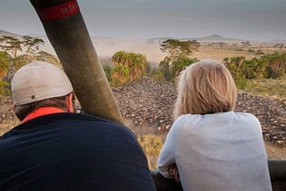 Why is a wildlife safari in Tanzania an unforgettable travel experience for honeymooners?