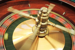 a spinning roulette wheel with a roulette ball inside