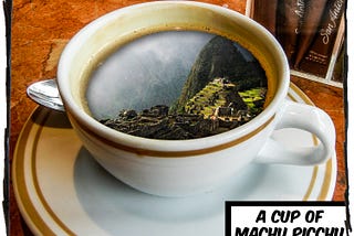 A picture of a white coffee cup sitting on an orange table. Inside the coffee cup is an image of Machu Picchu. The caption reads “A cup of Machu Picchu.”