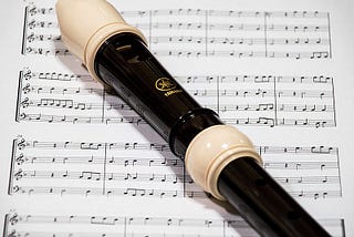 Photo of an alto-treble recorder with music