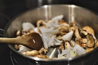 Photo of veggies in a skillet.