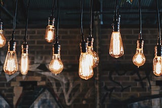 Vintage lightbulbs hanging from a ceiling.