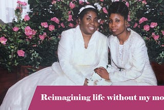 A black woman and her adult daughter are seated and holding hands.