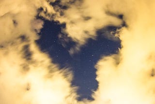 Clouds and stars shaped like a heart