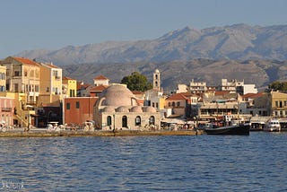 The town of Chania seen from the lighthouse. In the background, the beautiful mountains called lefka ori.