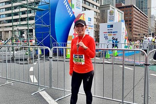 Me (Akari) holding a medal after finishing the Tokyo Marathon