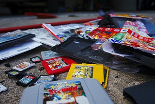 A few broken Nintendo cartridges of Pokémon games