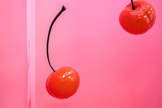 Two cherries falling down