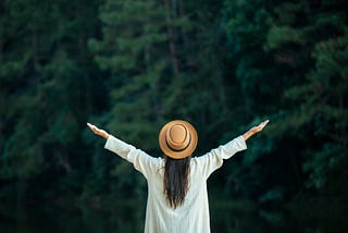 Female tourists spread their arms and held their wings