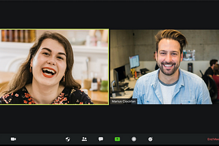 man and woman in a user experience interview video call, smiling
