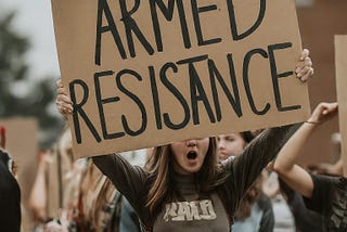 AI-generated picture of student holding a non-peaceful violent sign calling for “armed resistance”