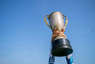 Person holding trophy