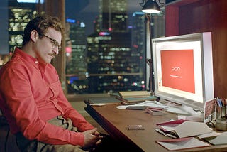 actor from the movie Her sitting in front of his computer