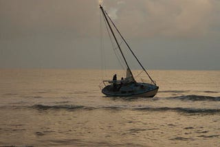 Image of a boat floating in the ocean.
