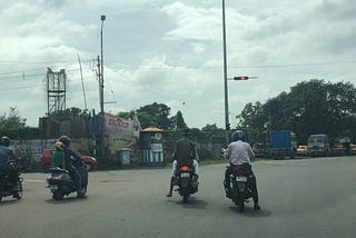 A picture taken on Garden Reach Circular road on 29-Jun-2019 — the riders of the second motorcycle wearing skullcaps