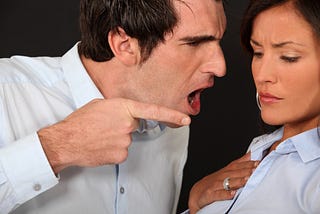 Photo of a man insulting a woman.