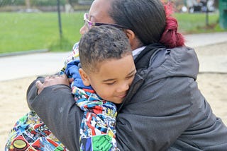 mother and son hugging