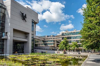 the roger stevens building and pond on the university of leeds campus
