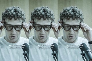 A still repeated three times shows Mark Zuckerberg putting on a pair of Meta glasses. A caption reads “I mean, this is basically what the interaction looks like.”