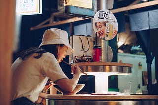 Japanese woman eating in a restaurant