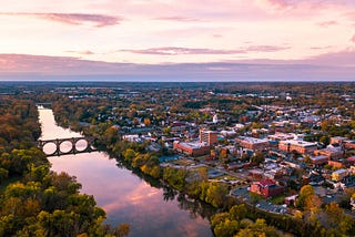 An aerial photo of Fredericksburg, VA, which includes the downtown area and the Rappahannock river.