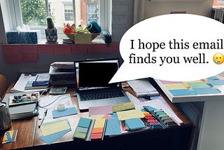 A messy desk covered in post-its and notecards