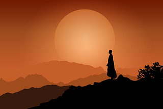 A monk’s silhouette at sunset