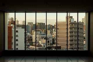 Photo from the inside of a flat looking outside through the window