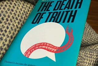 A copy of the Book The Death of Truth by Michiko Kakutani.