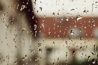 Rain on a window — Why Rainfall Is My Favorite Soundtrack for Writing