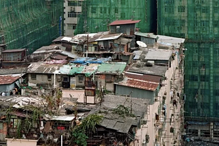 A row of rooftop dwellings in an urban environment