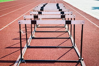 Hurdles lined up on a running track
