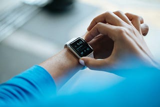 Woman setting her Apple watch.