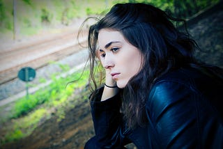 Woman sitting outdoor during day time