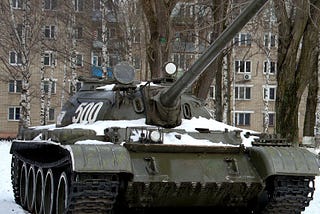 Russian Main Heavy Battle Tank in an urban area with snow cover on the ground.