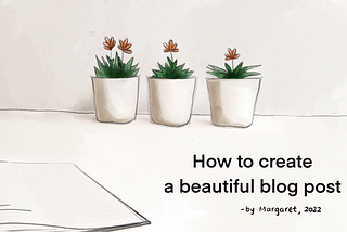 Three small potted flowers and a notebook on the desk.How to create a beautiful blog post.