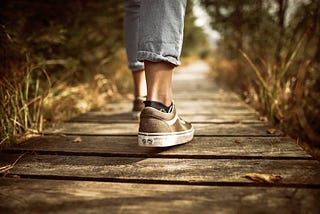 Person Walking on Brown Pathway. What happens when you walk with a weighted vest for a month