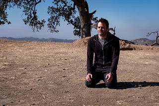 Bill Hader as Barry kneeling on the ground.