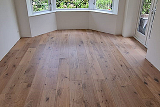 A rustic oak wood floor