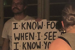 Me, Mitchell Crispi, holding a cue card on a set. The card aptly reads “I know fools when I see them,” though you cannot see the entirety of the card in the photo.