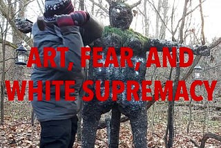 Demon-like statue with lanterns and offerings about to be hit in the head with a hammer by a man in winter apparel. The words “Art, Fear, and White Supremacy” cover the picture in big block red letters.