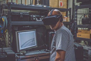 man with VR headset on, workshop background, 2023 technology trends